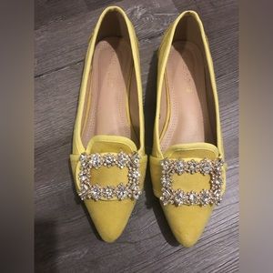 Rhinestone embellished ballerina flats.